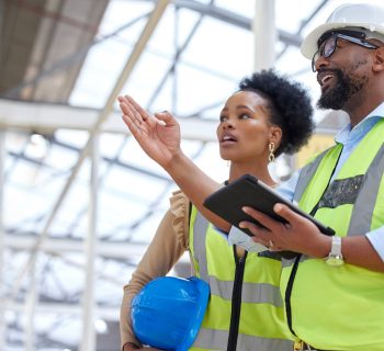 Construction job, strategy talk and teamwork from engineer planning staff at job site. Collaboration, architect team and communication together with tablet and industrial project with conversation