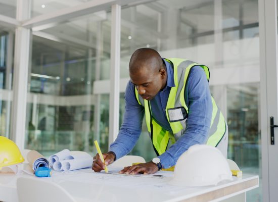 Serious architecture man drawing blueprint lines with design process, planning development and builder project tools. Floor plan construction and focus of engineer black person or business contractor